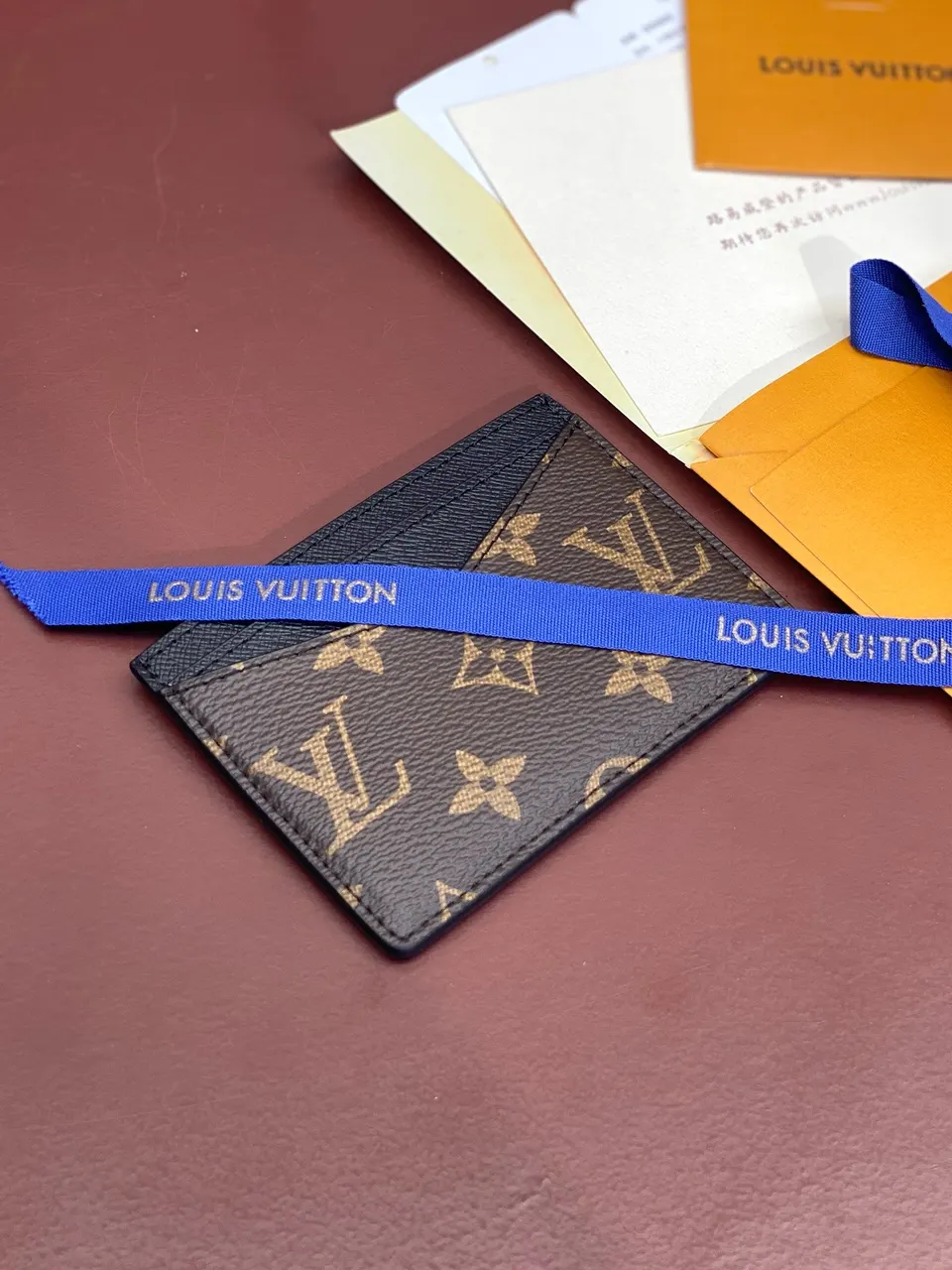 Louis Vuitton men’s wallet with brown floral card holder
