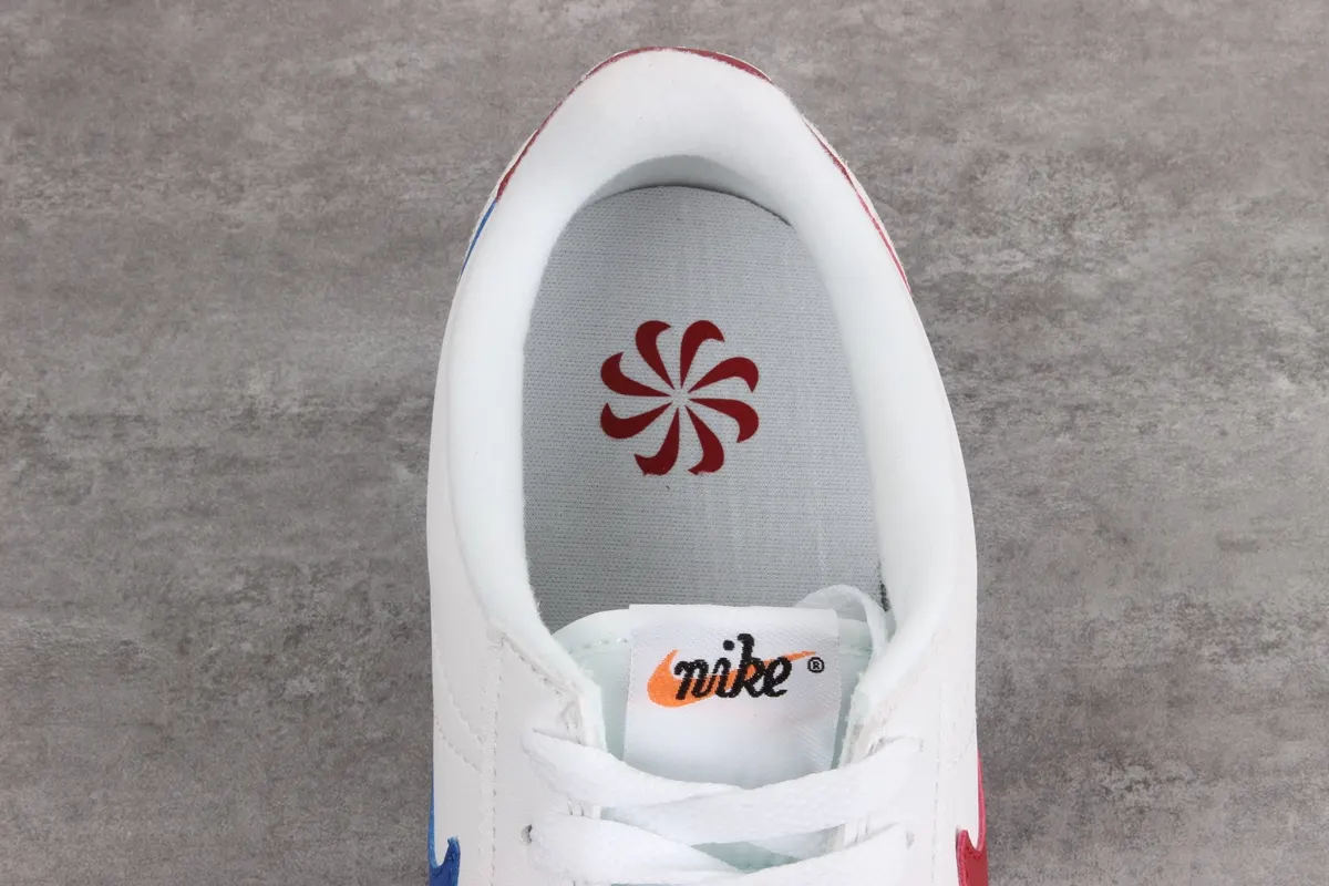 Nike Cortez leather trainers in white with red swoosh